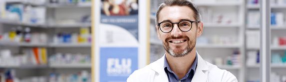A smiling male pharmacist 