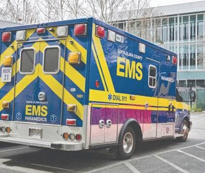 An EMS vehicle parked in front of a building