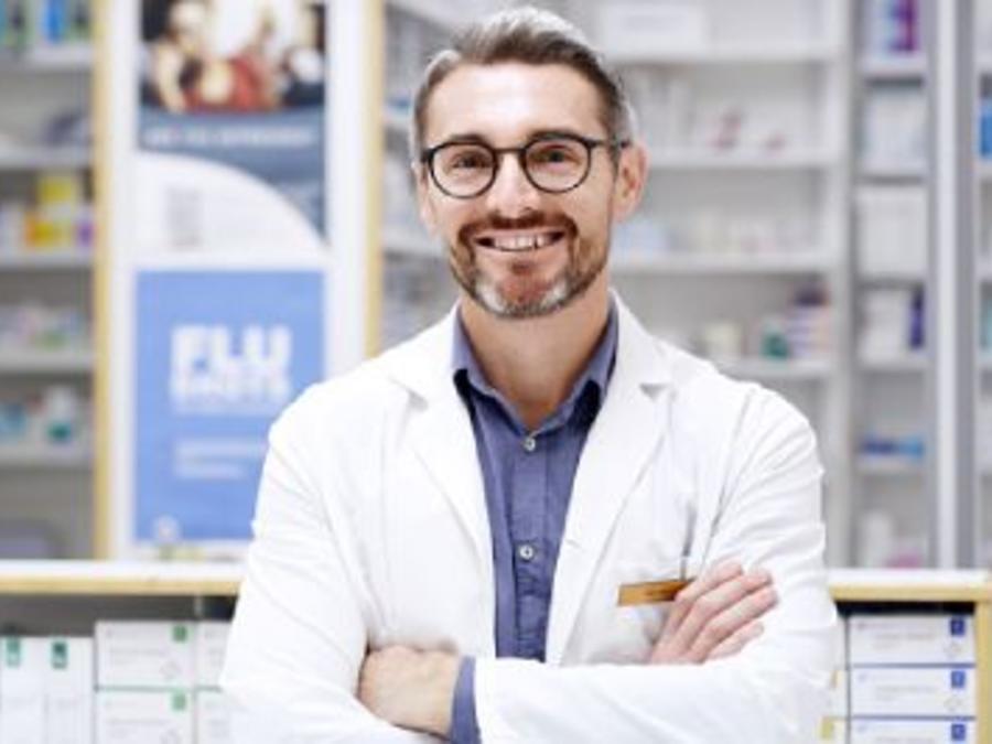 A smiling male pharmacist